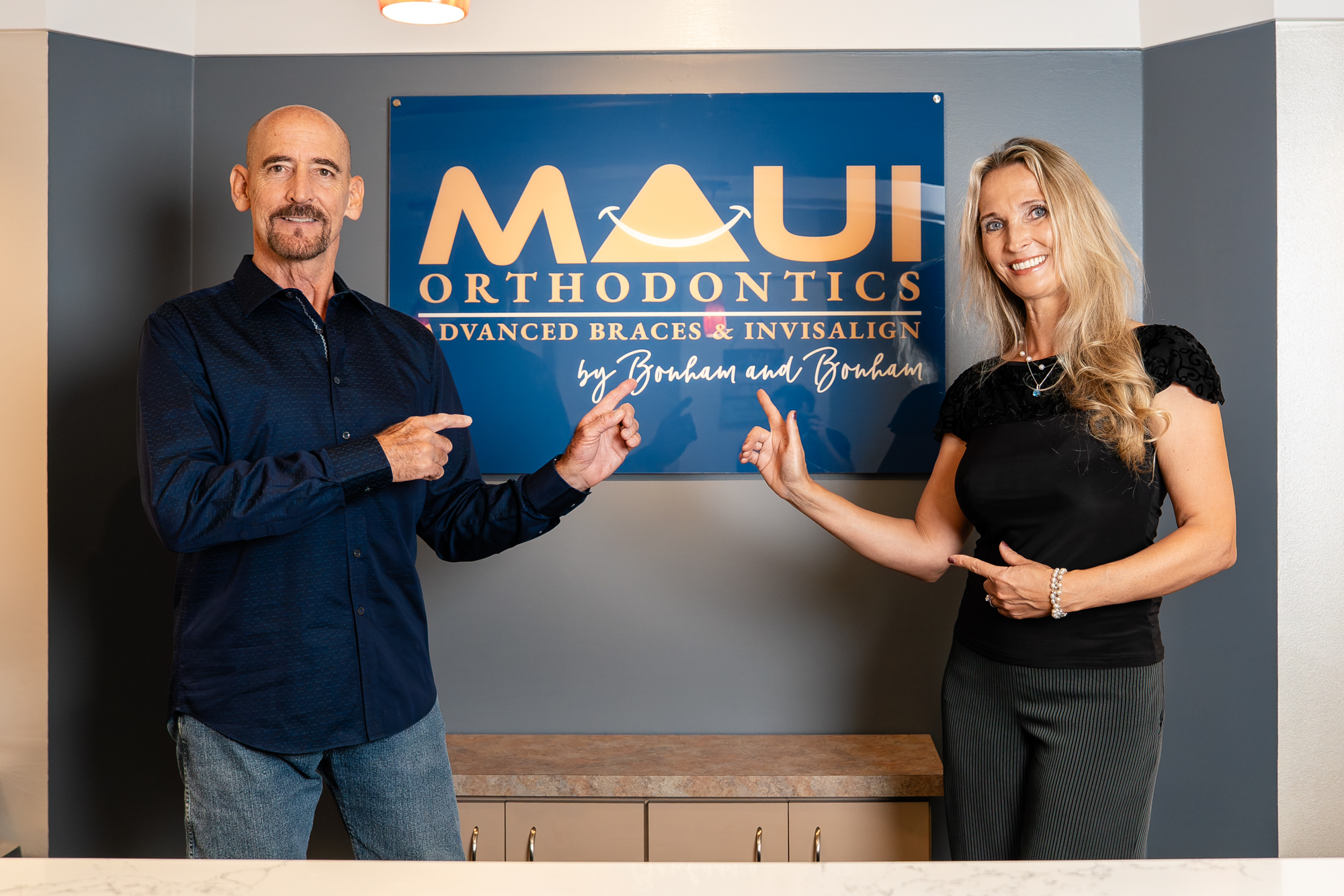 Drs. Paul and Aurelia Bonham of Maui Orthodontics, braces and Invisalign specialists, welcoming patients.