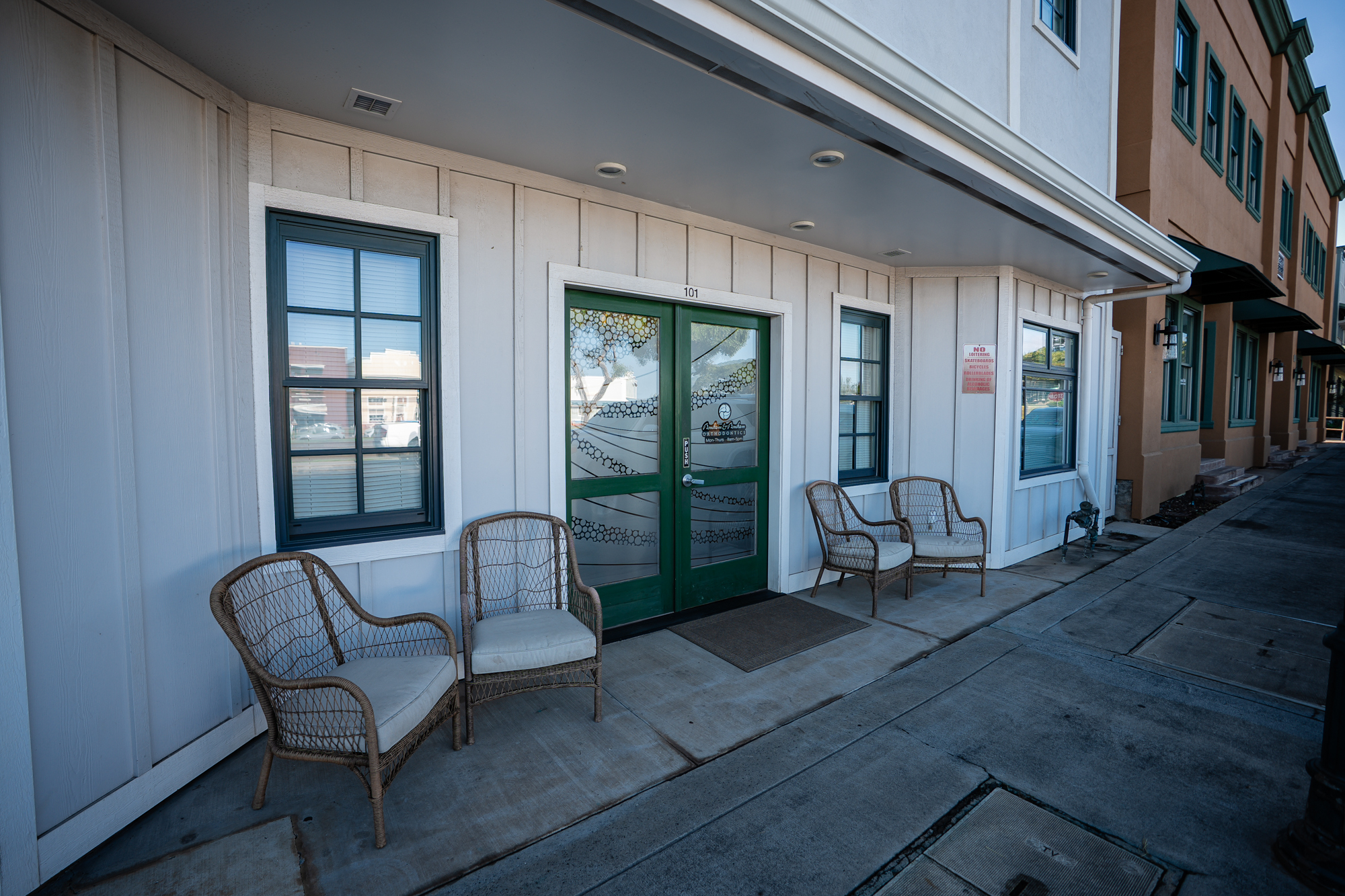 Welcoming entrance to Maui Orthodontics Pukalani office with chairs and signage.