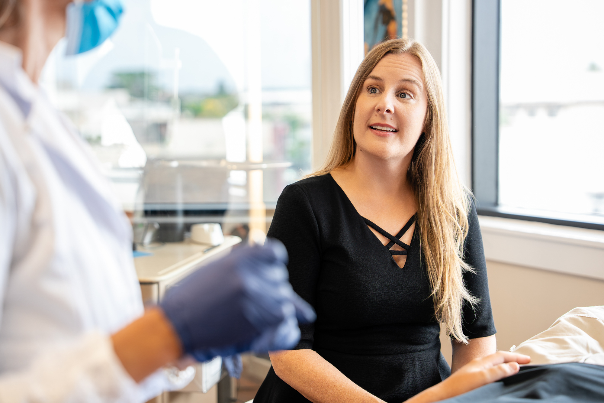 A smiling patient talks with her Maui Orthodontics orthodontist, Dr. Aurelia Bonham, during an orthodontic appointment in the Kahului office.